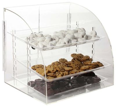 Dry bakery display case with cookies and donuts.