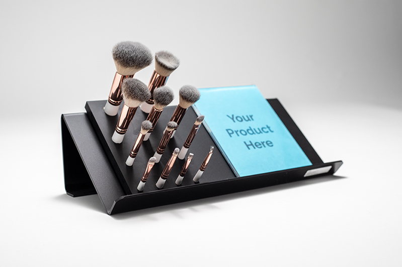 Retail touch and feel display showing makeup brushes.