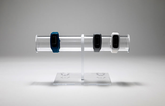 Plastic stand displaying watches.