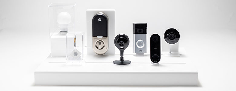 Retail display rack displaying various smart home security cameras.